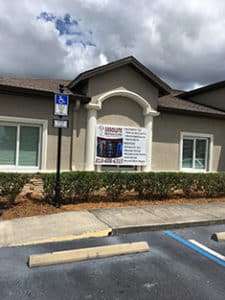 Pic of Banner Sign Hanging on Front of Riverview Chiropractic Office Building