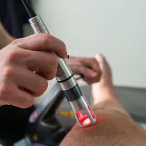 Riverview Chiropractor Performing Cold Laser Therapy on Brandon Man