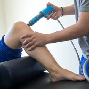 Brandon Chiropractor Performing Shockwave Therapy on a Riverview Man