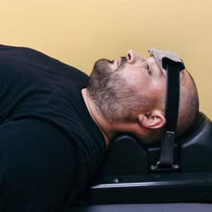 Riverview Man On Chiropractic Table in Brandon FL for Spinal Decompression Therapy