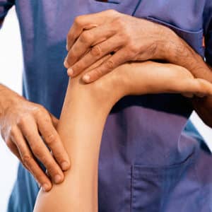 Brandon Chiropractor Giving Therapeutic Massage Treatment on Riverview Woman