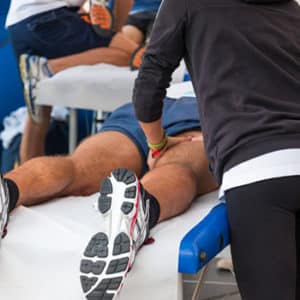 Riverview Chiropractor Giving Therapeutic Massage Treatment on Brandon Athlete