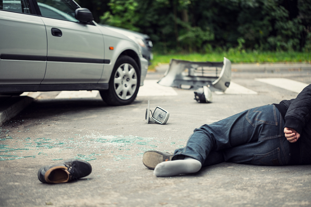 Brandon FL Man Involved in a Motor Vehicle Accident Touching Back As a Sign For Need For Chiropractor