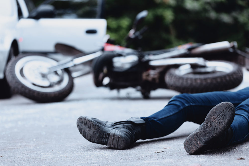 Man In Need of Chiropractic Services Lying on the Ground After Motorcycle Accident in Riverview FL