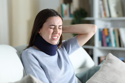 Lady With Neck Bandage and Persistent Headache In Need of Personal Injury Chiropractor in Riverview FL