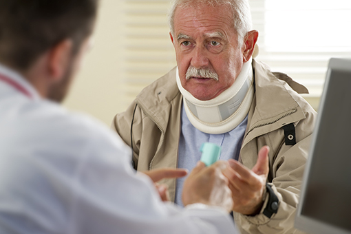 Old Man Wearing Cervical Collar Asking Chiropractor How To Recover From Whiplash Injury