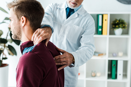 Brandon Man Getting Treated For Whiplash Injury at a Chiropractor's Clinic